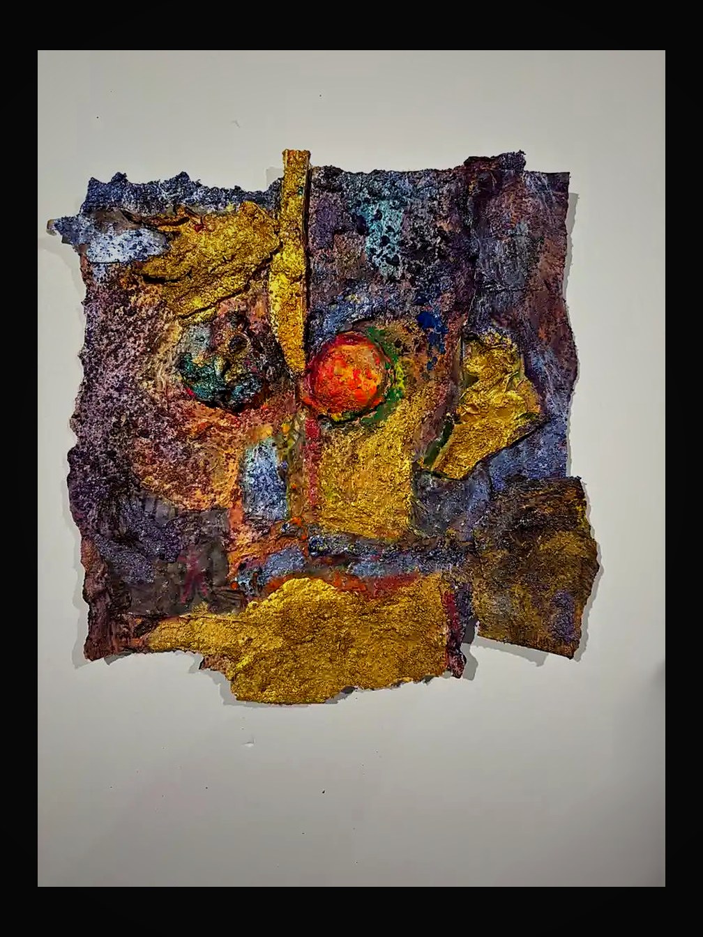 Bold square composition — gold leaf and purple textures bisected by a vertical staff with radiant orb