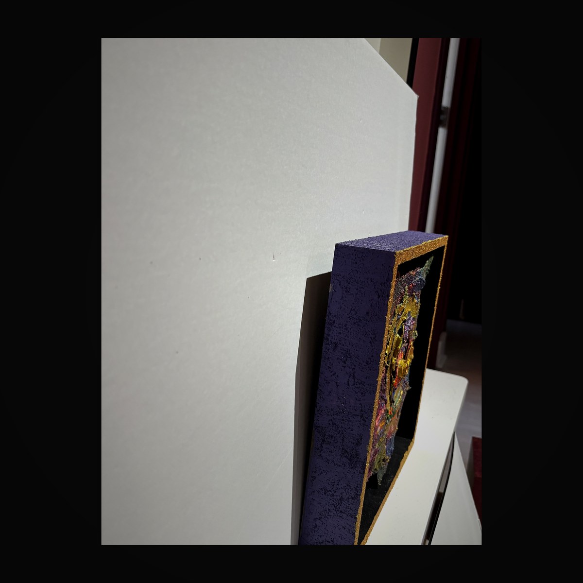 Purple vessel shadow box with deep violet enamel and gold trim