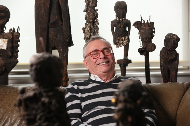 William Harper in his studio surrounded by his art collection